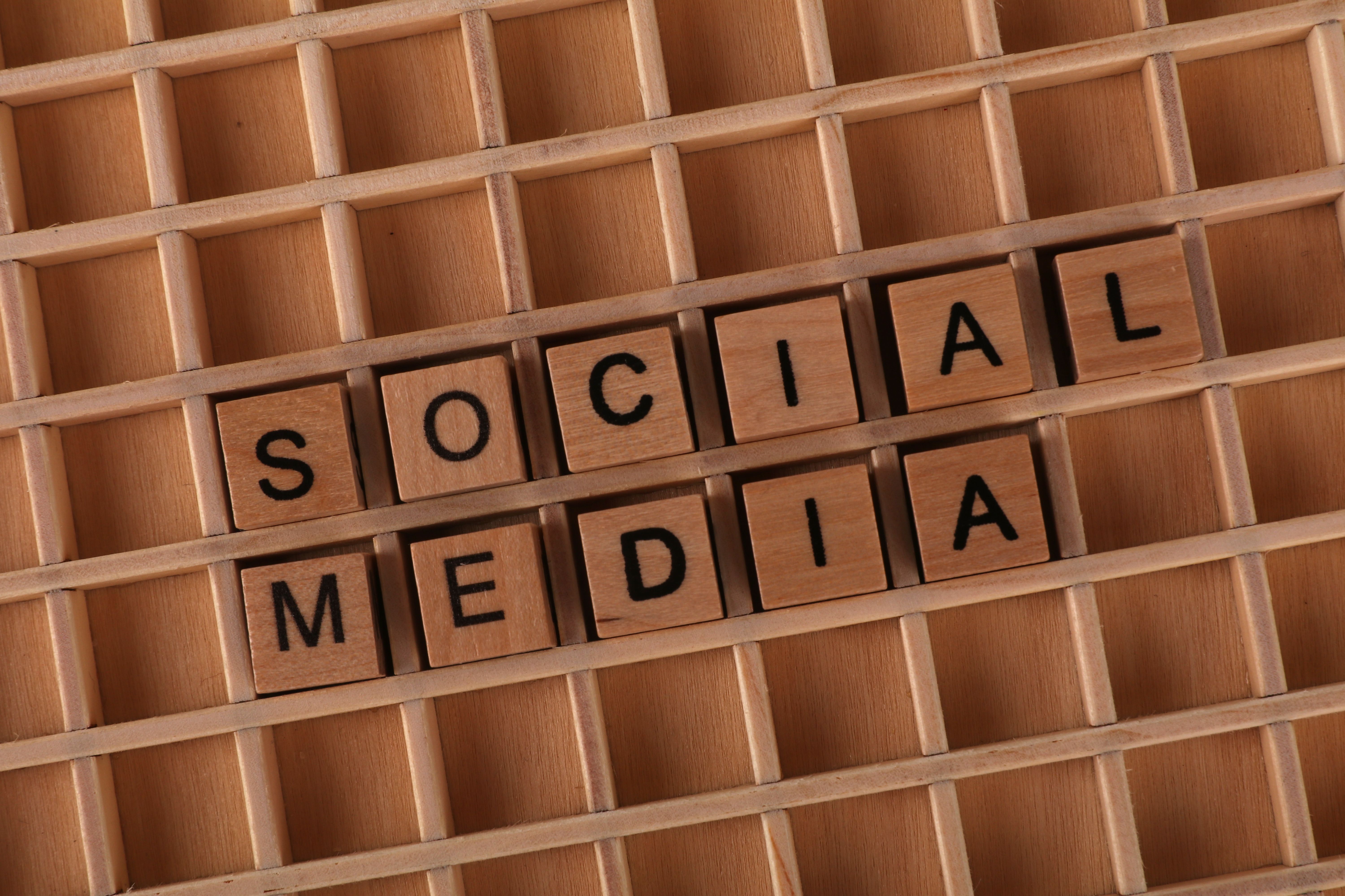 Wooden letter tiles spelling social media